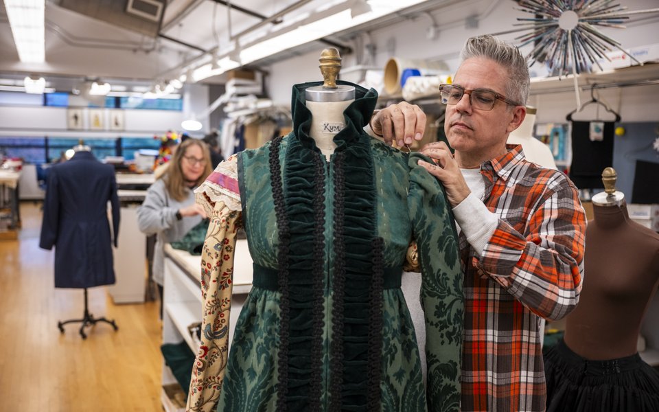 Draper/Tailer DJ Gramann II works on a costume in the Guthrie's in-house costume shop.