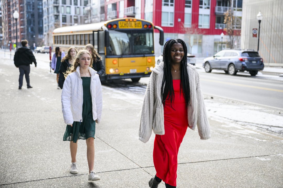 Students disembark a school bus
