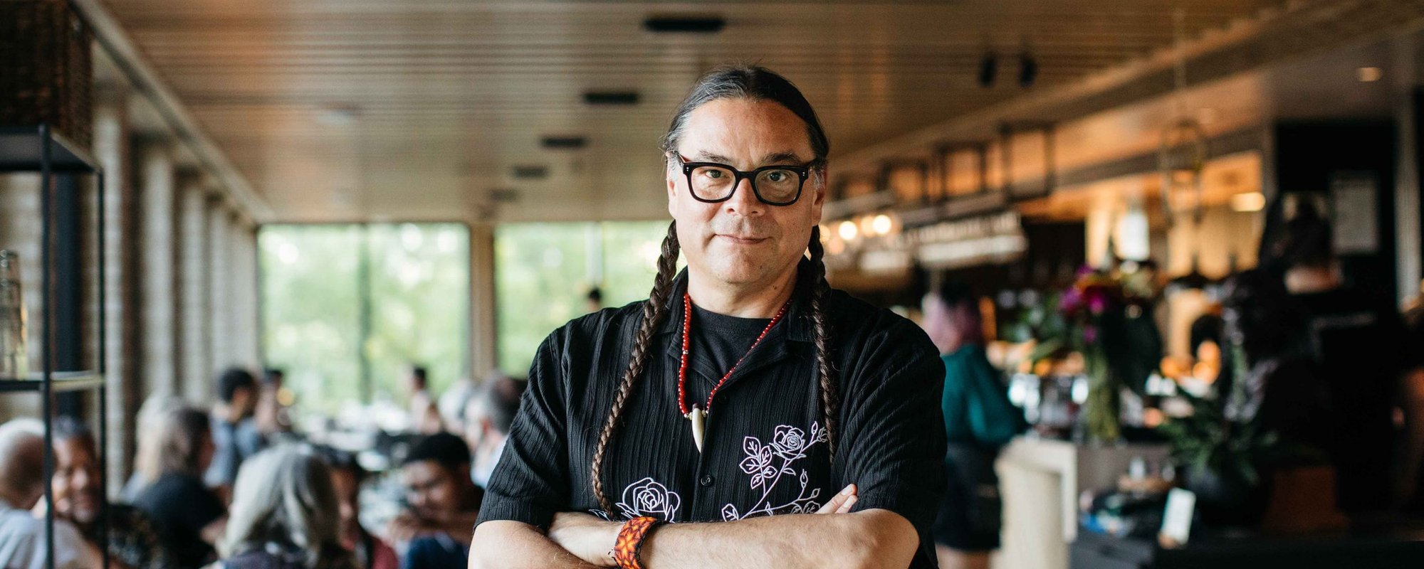 Chef Sean Sherman poses in the original Owamni restaurant space (Caitlin Abrams)