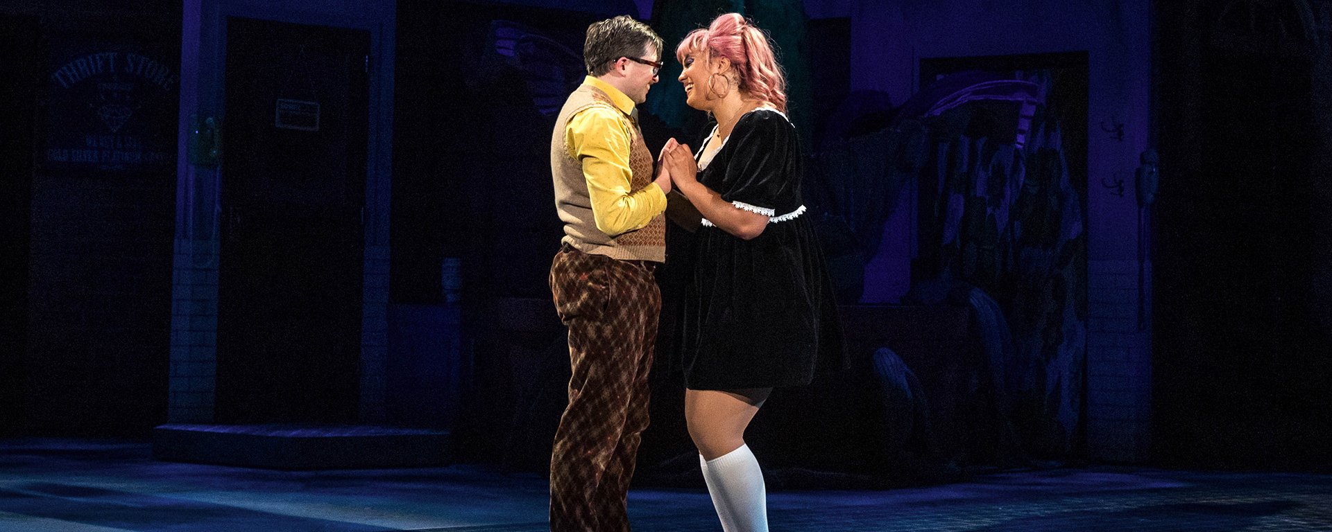 Two actors perform a scene in Little Shop of Horrors.