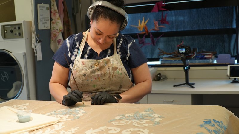 Costume Craftsperson/Dyer Vanessa J. Lopez dyes a filigree detail for a costume.