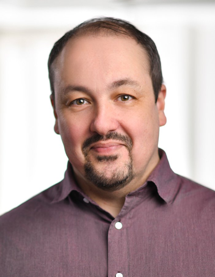 A headshot of Paul Whitaker